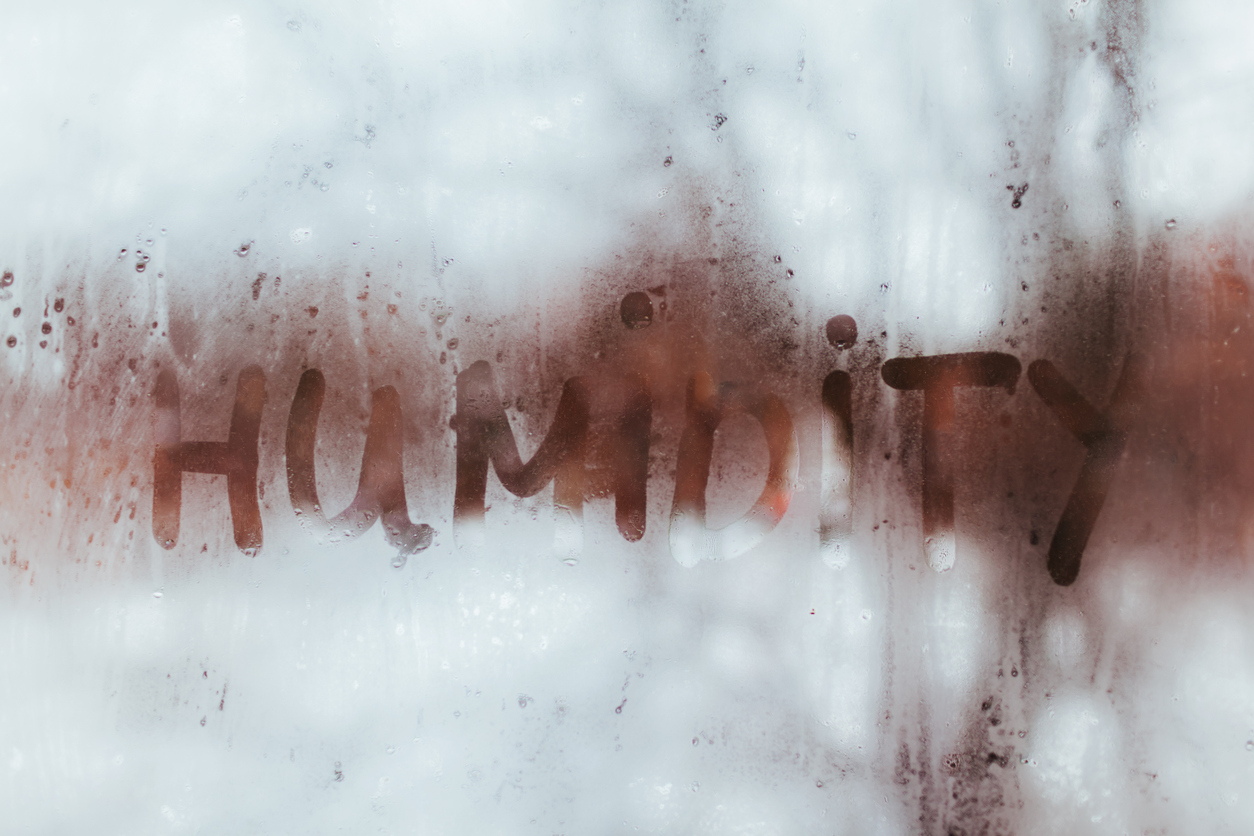 Humidity Written in Water on Window