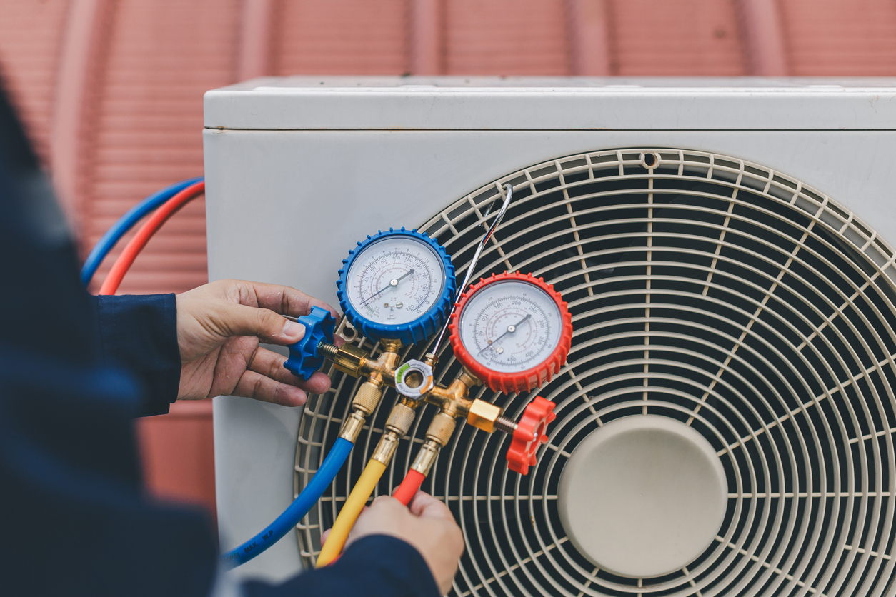 Tech Checking AC Unit